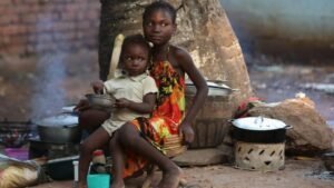 Children have their meal in a camp for internally displaced people on the grounds of the Saint Sauveur church in the capital Bangui, Central African Republic